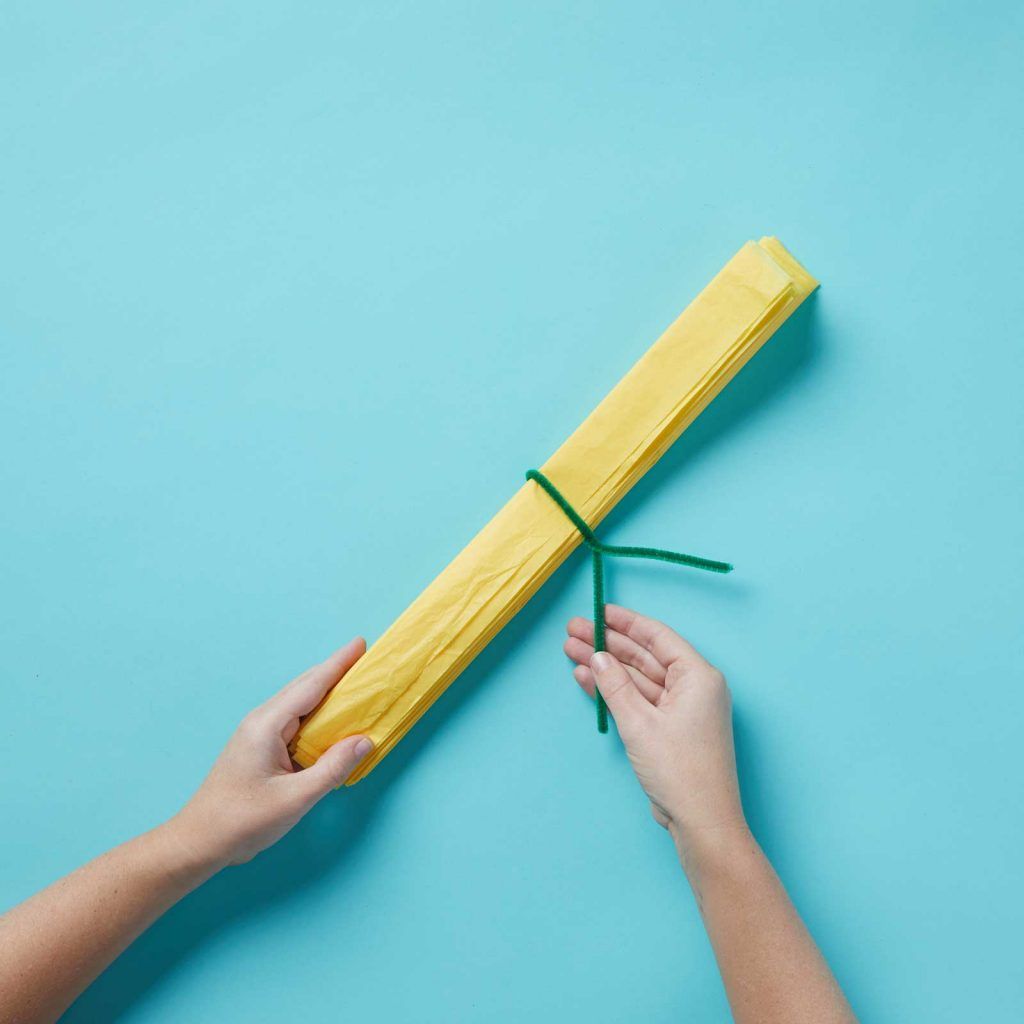 Tying up tissue paper with pipe cleaner