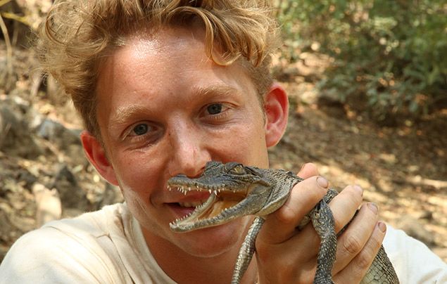 Out There With Jack Randall: Jack posing with an infant crocodile