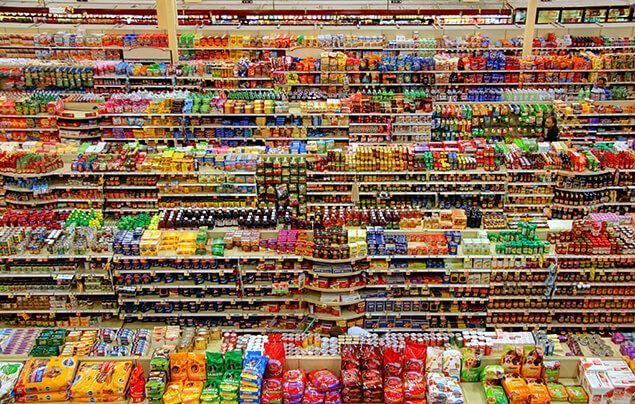 colourful supermarket shelves are covered in packages