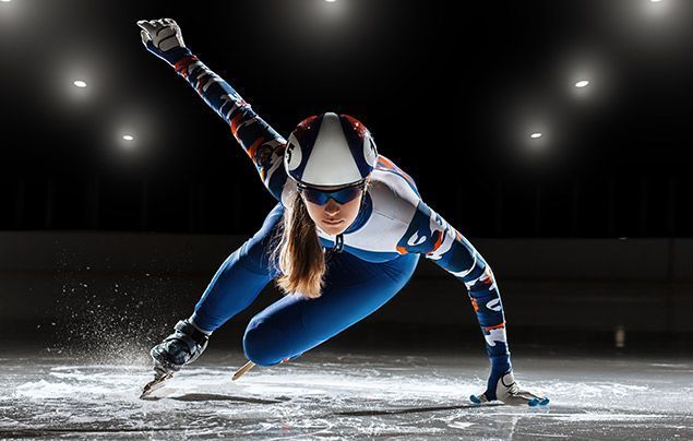 winter olympics facts | a female skater powers across the ice