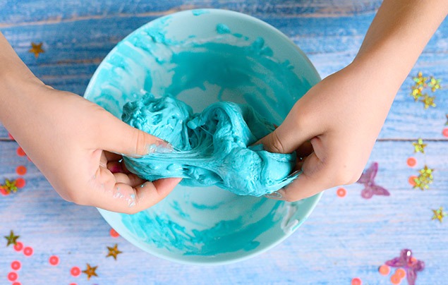 eco-friendly slime scrunched in hands