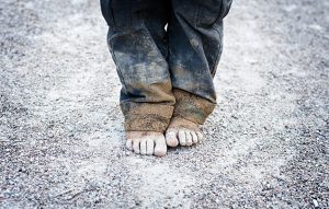Living Wage | child with no shoes