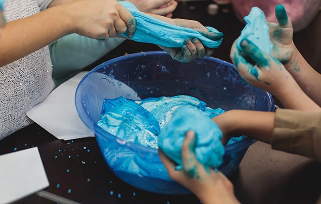 sensory play | children make blue squishy slime in a bowl