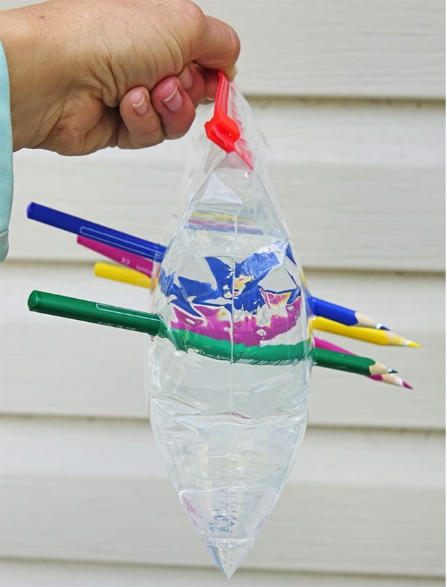 science experiments for kids | a bag of water with coloured pencils poked through it