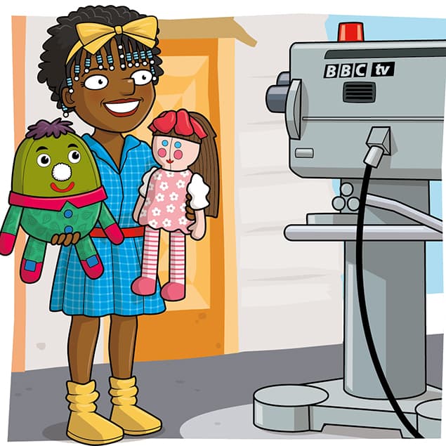 A smiling woman in a blue dress, holding two colourful dolls, stands in front of a large BBC TV camera—ready for filming a kids TV programme