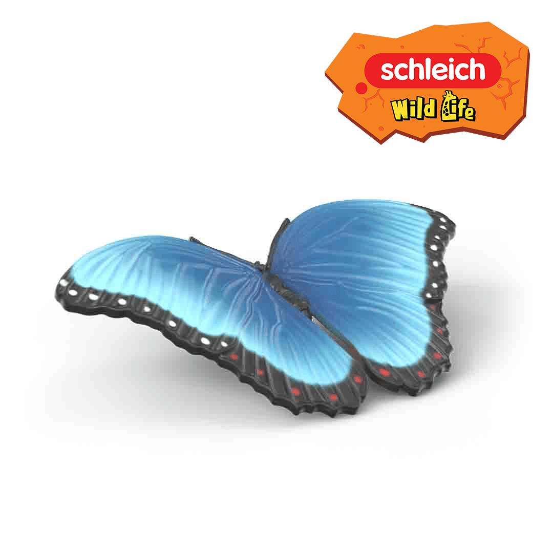 A blue butterfly toy with black-edged wings and small red spots, shown on a white background. Perfect for any insect kit or collection of insects, this toy brings nature’s beauty to playtime. The Schleich Wild Life logo appears in the top right corner.
